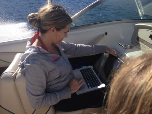 This is me, on our family vacation in 2013, finishing my second book proposal, due that day, while my 10 year-old daughter drove the boat (in my husband's lap) back to the dock so I could email it out! Talk about too busy.