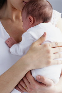 Mother Holding Infant --- Image by © Royalty-Free/Corbis